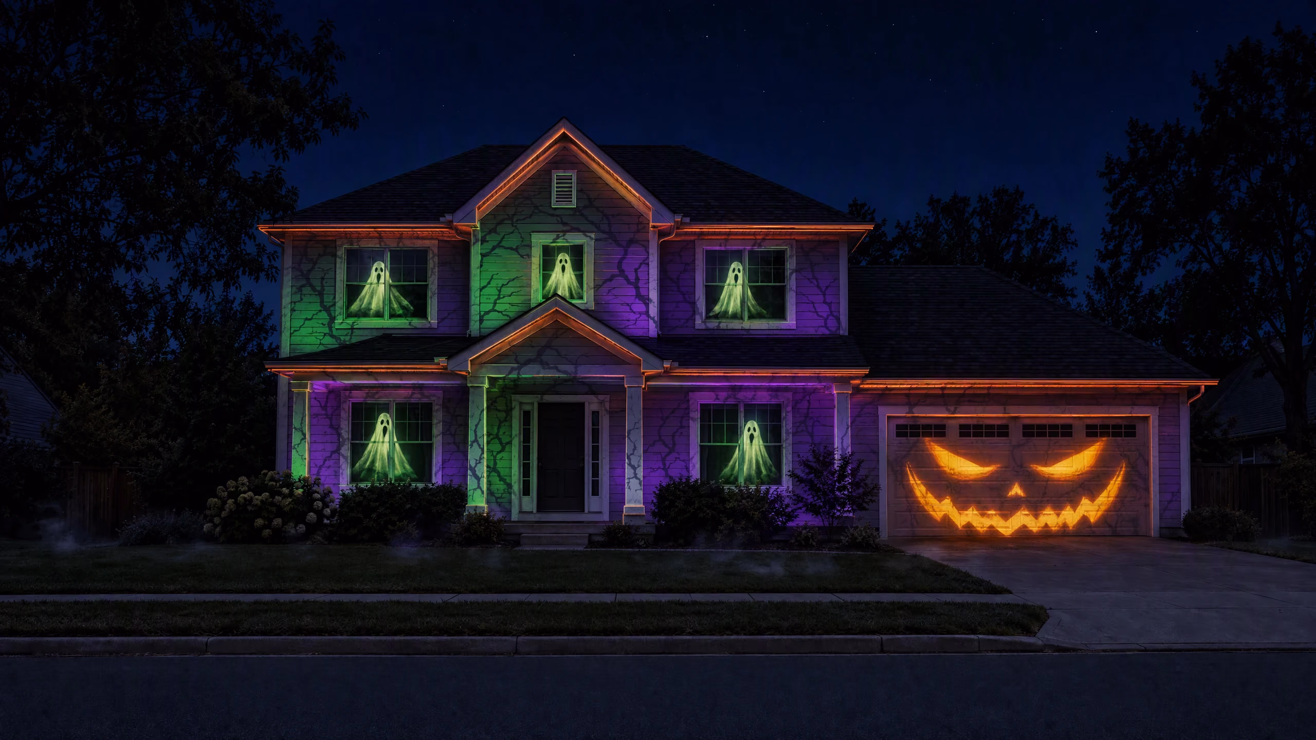 A two-storey house lit with the Haunted Facade Halloween projection show
